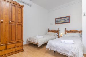 A bed or beds in a room at Villa Luna