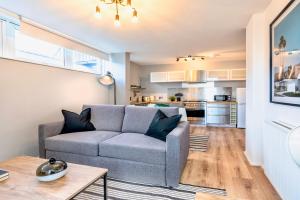 a living room with a couch and a table at Be London - Covent Garden Residences in London