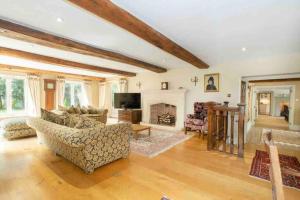 a living room filled with furniture and a fireplace at Stunning Country Farm House between Bristol & Bath in Bristol