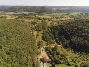 an aerial view of a road in a forest at Maison de Charme l Etoile in Saint-Vincent-de-Cosse