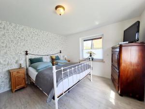 Ένα ή περισσότερα κρεβάτια σε δωμάτιο στο Ferienhaus Vergissmeinnicht