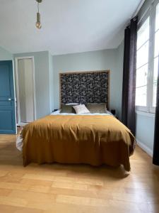 Giường trong phòng chung tại Gîte les Remparts