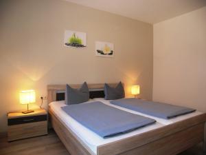 Postel nebo postele na pokoji v ubytování Ferienwohnung Plötz- mit Sonnenterrasse und E- Auto Ladestation