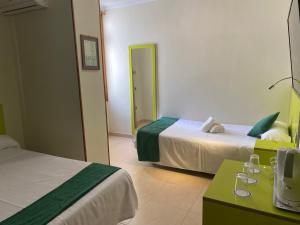 Postel nebo postele na pokoji v ubytování Hotel Andrea´s
