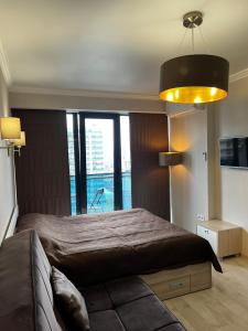 Lova arba lovos apgyvendinimo įstaigoje Beach Tower Apartment
