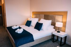 Ένα ή περισσότερα κρεβάτια σε δωμάτιο στο Jesionowa Noclegi