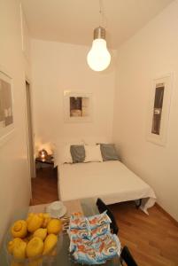 a living room with a table and a bed at Vatican Sunset Guest House in Rome +11 photos