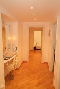 a hallway with a room with a sink and a bedroom at Vatican Sunset Guest House in Rome
