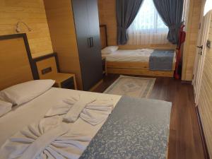 Postel nebo postele na pokoji v ubytování Garden Pansiyon Çıralı
