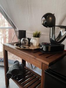 a wooden table with a plate of food on it at Skywoods.glamping in Molėtai +12 photos