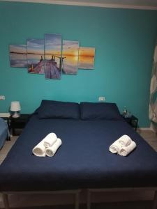 Łóżko lub łóżka w pokoju w obiekcie Casa Mia