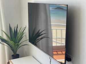 A television and/or entertainment centre at Oktheway Perbes Beach 2