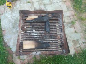 a statue of a person sitting on a grill at A.R . Homestay in Shimla