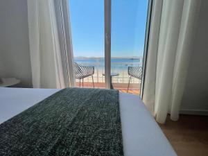 A bed or beds in a room at Oktheway Perbes Beach 2
