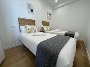 A bed or beds in a room at Oktheway Perbes Beach 2