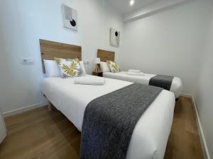 A bed or beds in a room at Oktheway Perbes Beach 2