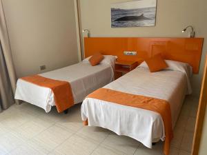 Een bed of bedden in een kamer bij Hotel Andrea´s