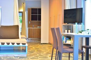 TV a/nebo společenská místnost v ubytování Hotel Peli