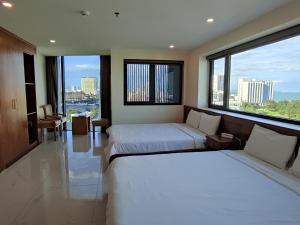 Postel nebo postele na pokoji v ubytování HỒNG HẢI 2 HOTEL