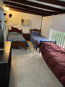 Postel nebo postele na pokoji v ubytování Termas de Río Hondo Casona Laconte + 23 fotografií