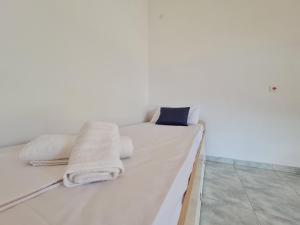A bed or beds in a room at Myrtia Guest House