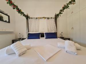 A bed or beds in a room at Myrtia Guest House