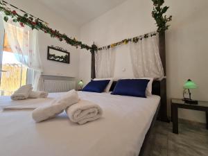 A bed or beds in a room at Myrtia Guest House