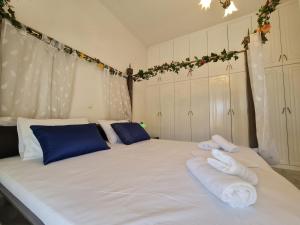 A bed or beds in a room at Myrtia Guest House