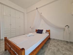 A bed or beds in a room at Myrtia Guest House