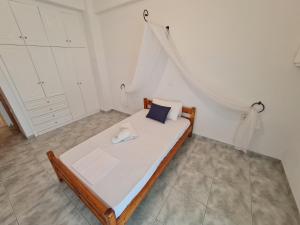 A bed or beds in a room at Myrtia Guest House