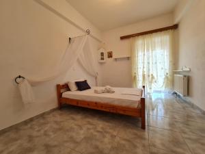A bed or beds in a room at Myrtia Guest House