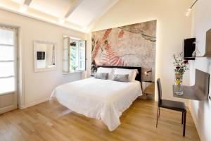 Postel nebo postele na pokoji v ubytování La Madernassa Resort - Casalora Dimora Storica di Charme