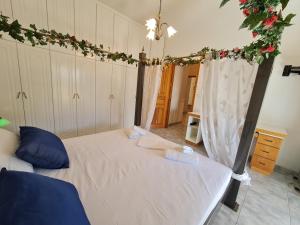 A bed or beds in a room at Myrtia Guest House