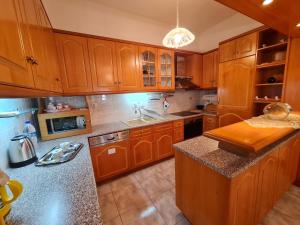 A kitchen or kitchenette at Myrtia Guest House