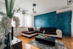 a living room with a couch and a table at Villa Lidija in Omiš