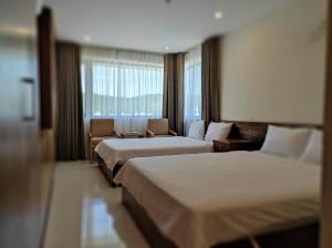 Postel nebo postele na pokoji v ubytování HỒNG HẢI 2 HOTEL