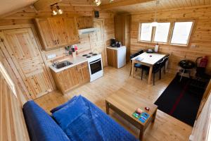 an overhead view of a living room and kitchen in a log cabin at Mid Hvoll Cottages in Suður Hvoll