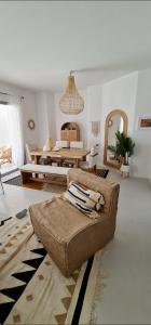 a living room with a couch and a table at EL Gouna Swan Lake Apartment in Hurghada