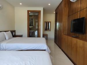 Postel nebo postele na pokoji v ubytování HỒNG HẢI 2 HOTEL