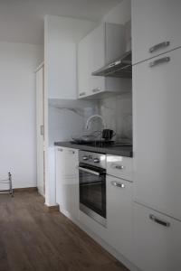 Kuchyň nebo kuchyňský kout v ubytování Apartments Bonaca Rovanjska