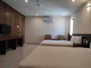 Postel nebo postele na pokoji v ubytování HỒNG HẢI 2 HOTEL