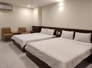 Postel nebo postele na pokoji v ubytování HỒNG HẢI 2 HOTEL