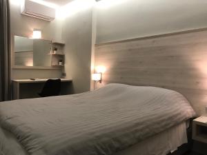 Voodi või voodid majutusasutuse Plaza Hotel toas