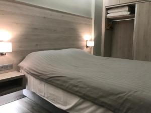 Voodi või voodid majutusasutuse Plaza Hotel toas