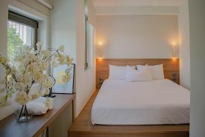 Posteľ alebo postele v izbe v ubytovaní Filopappou Hill Suites by Athens Stay