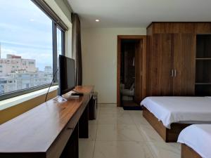 Postel nebo postele na pokoji v ubytování HỒNG HẢI 2 HOTEL