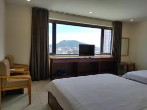 Postel nebo postele na pokoji v ubytování HỒNG HẢI 2 HOTEL
