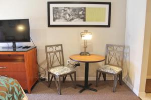 A television and/or entertainment centre at Bell & Main Alamosa Studio Suite-Walking distance to downtown
