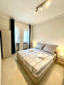 Кровать или кровати в номере Lugaro Guest House