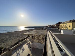 a view of the beach from the roof of a building at Bed & Parking Cecina Rooms in Cecina